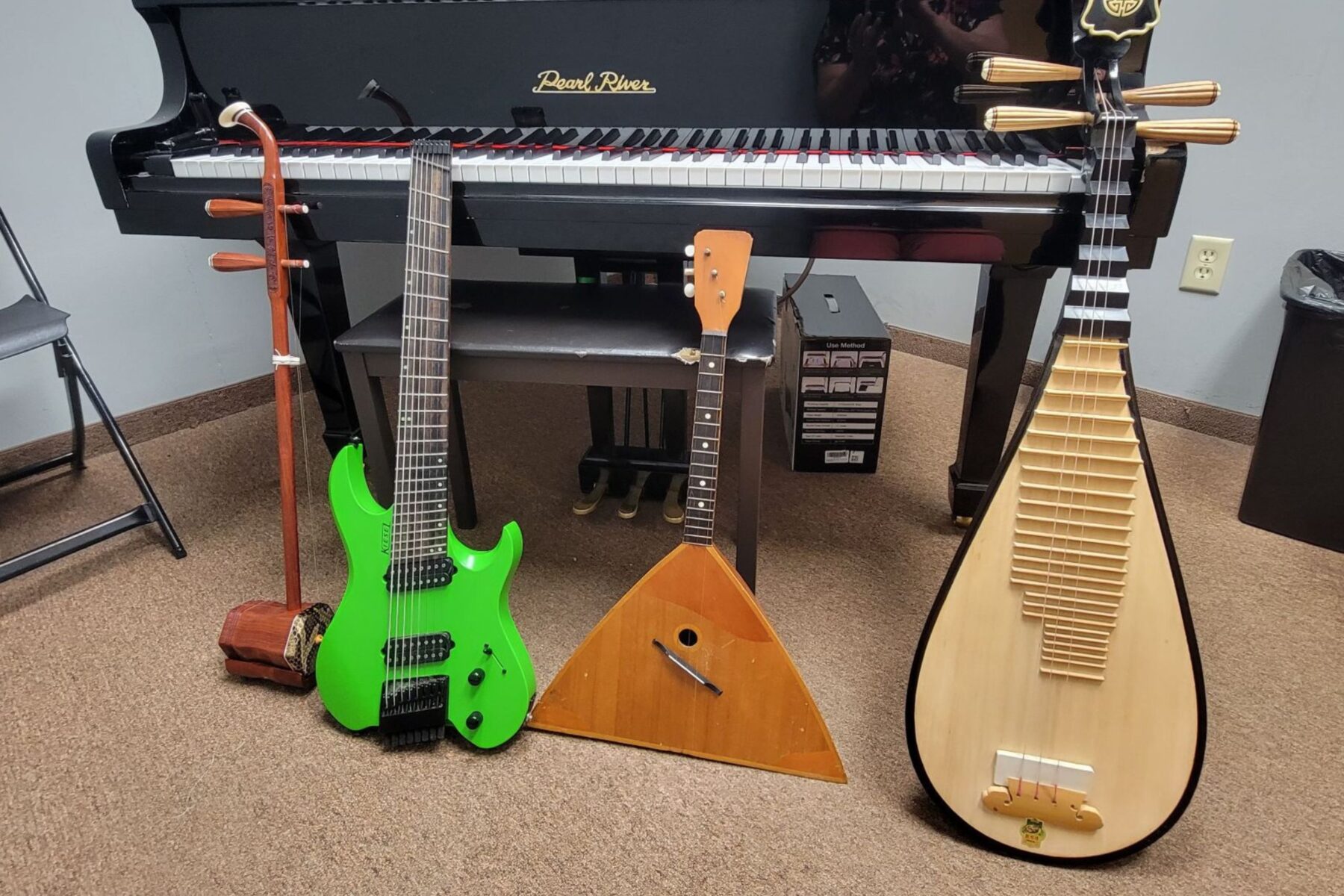 a lineup of string instruments from all over the world