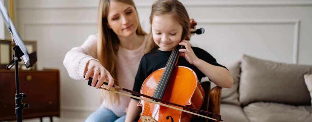 Young student learning to play the cello