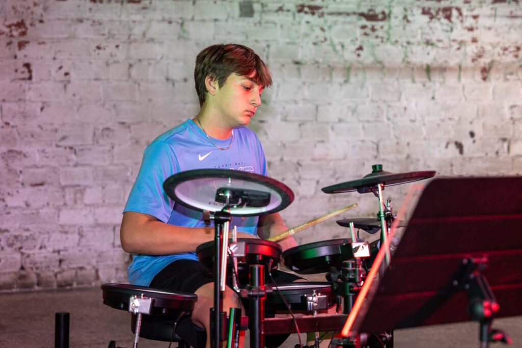 Student Playing Drums