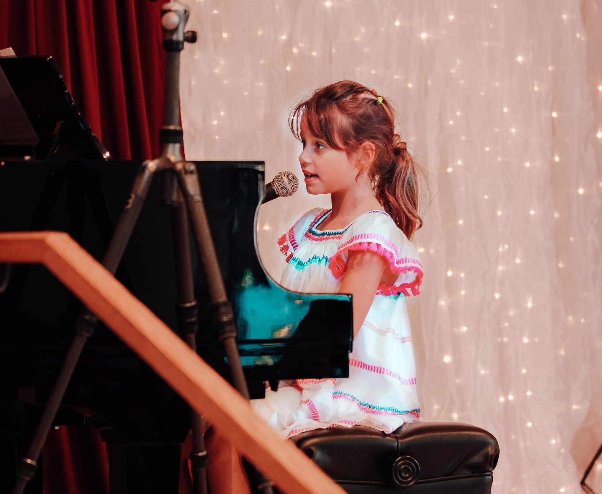 student at inside voice playing the piano