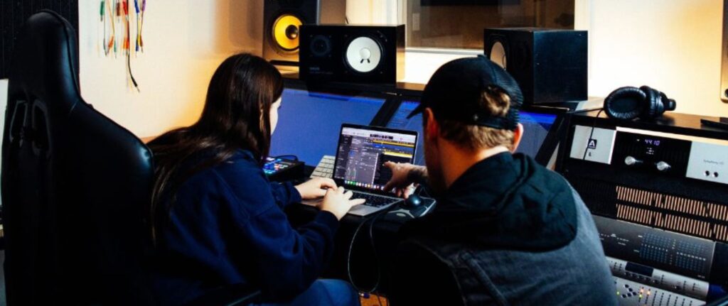 teacher and student in audio production class