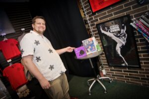 employee standing in front of merchandise