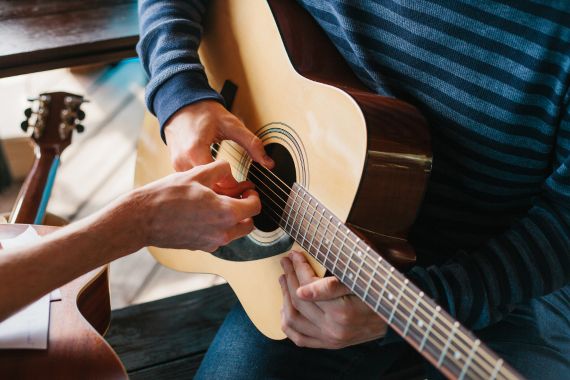 Student Playing the guitar Orland Park IL