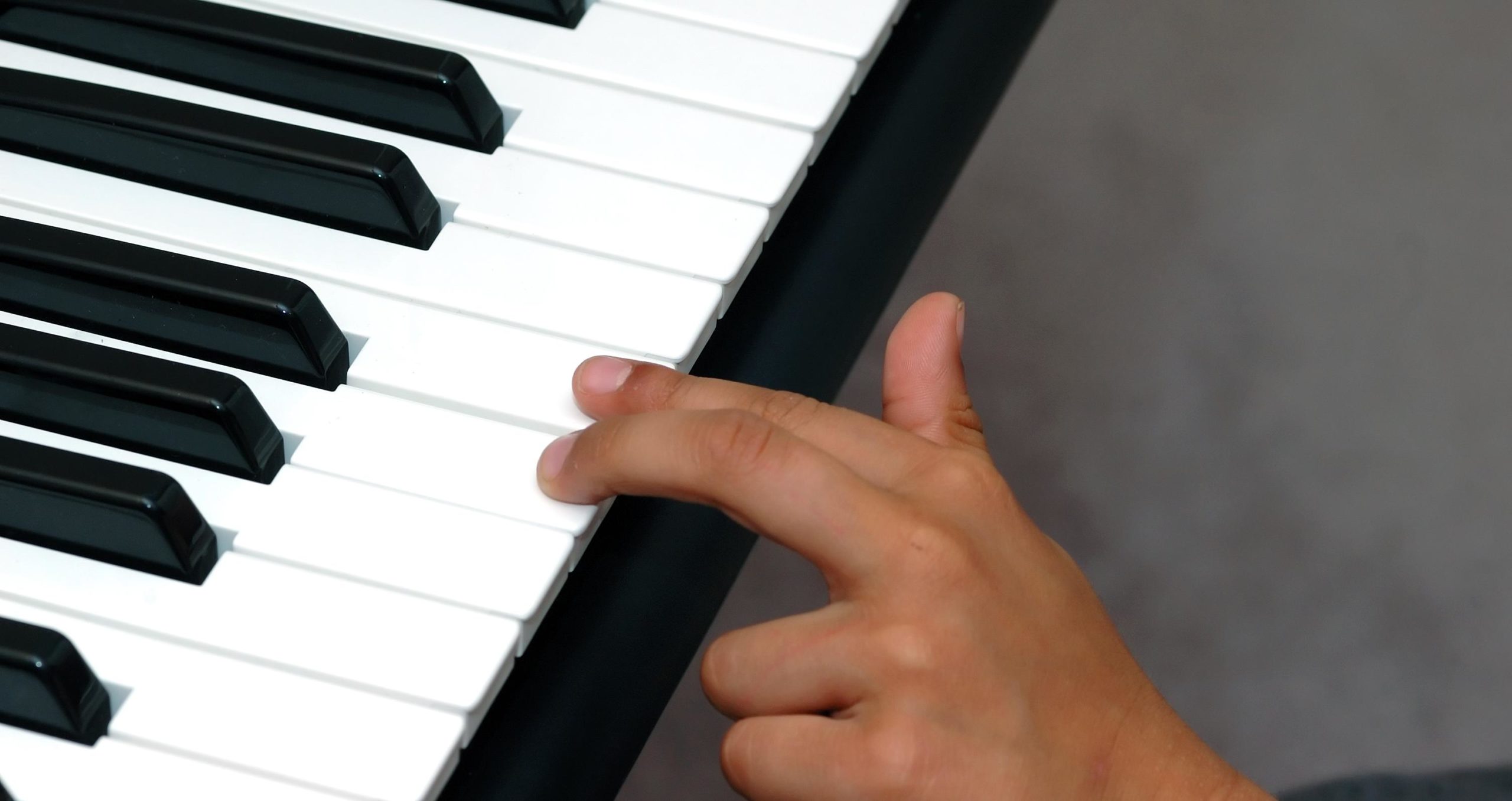 kid playing the piano at Velocity Music Academy