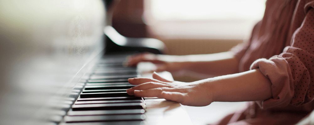 kid playing the piano