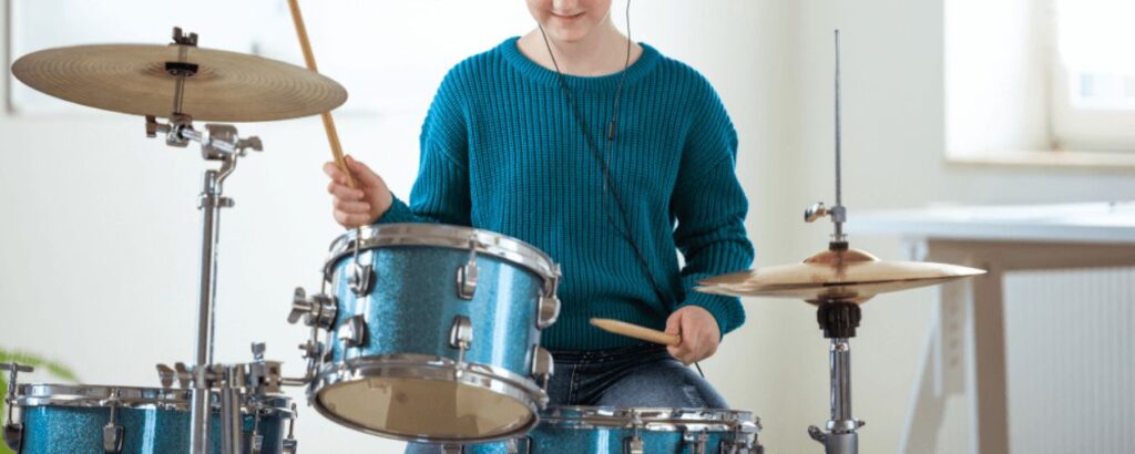 student playing the drums