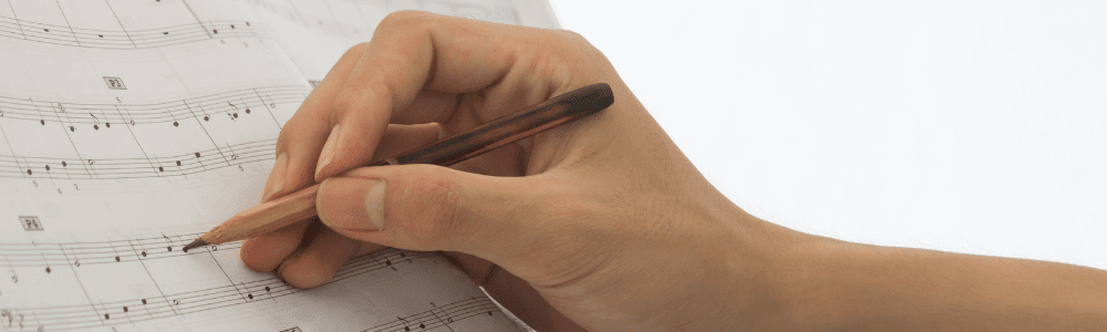 hand writing sheet music