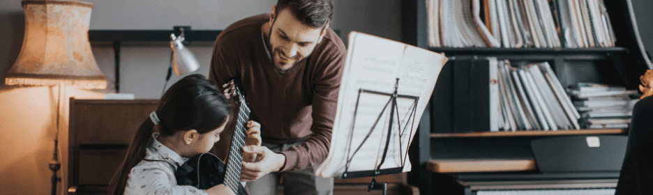 teaching a child student guitar