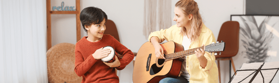 teacher and the student playing music together