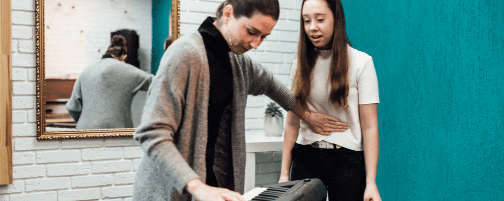 teacher teaching vocal exercises