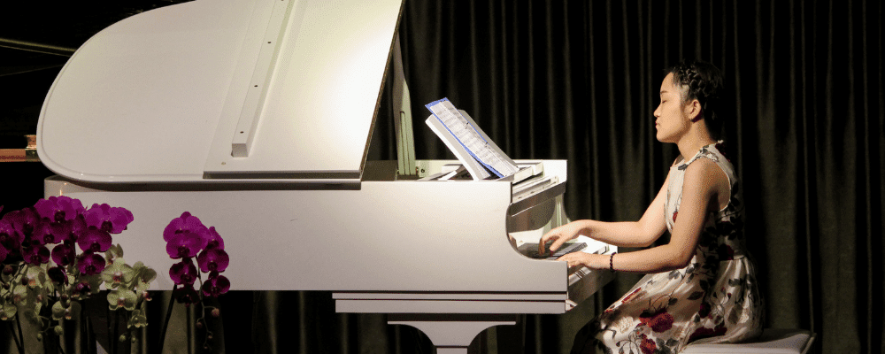 girl playing the piano