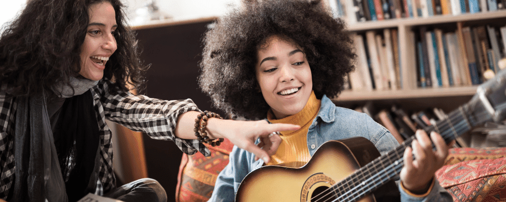 girl playing the guitar