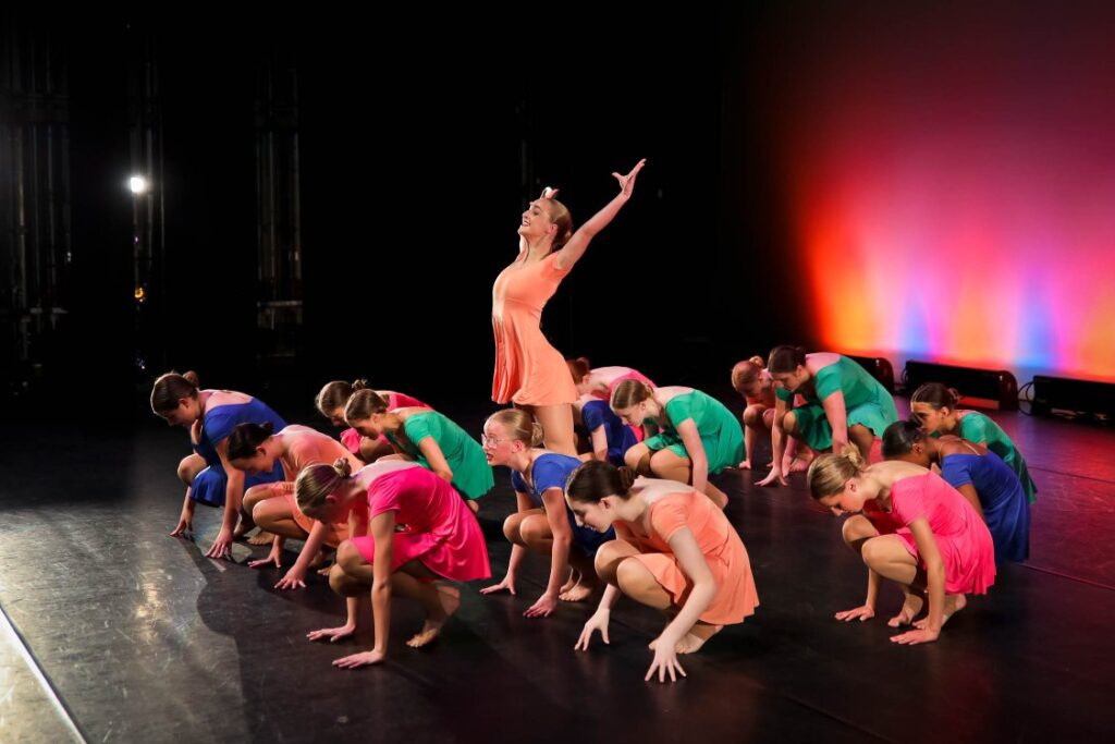 dancers on stage performing 