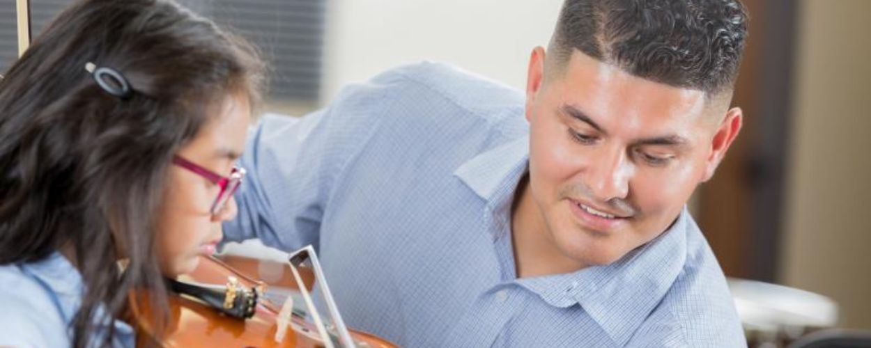 student learning to play the violin