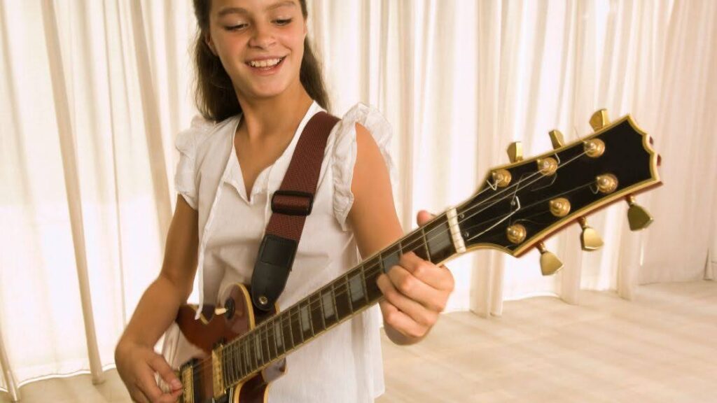 girl playing guitar