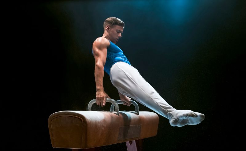 male on balance bar gymnastics