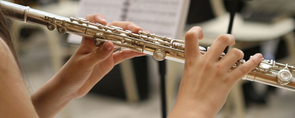 student playing the flute