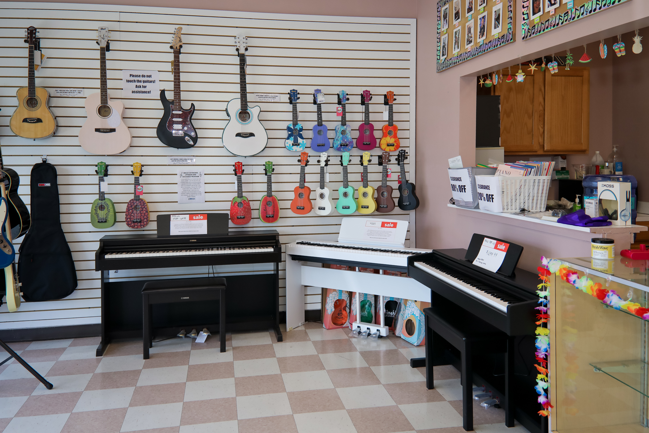 Music store with guitars and ukuleles hanging on the walls